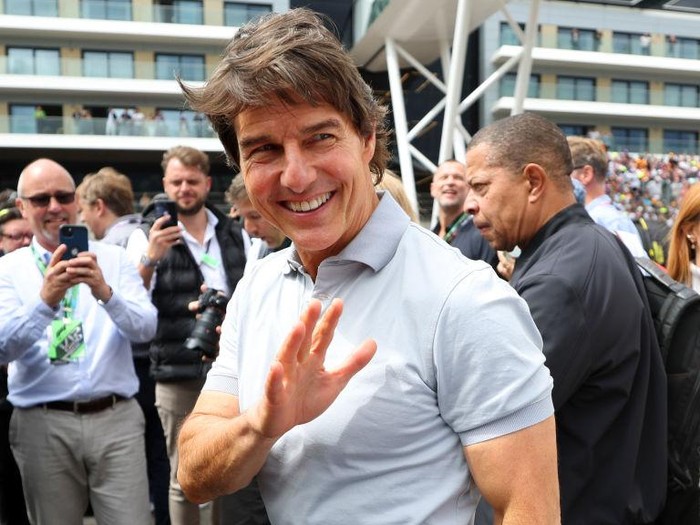 NORTHAMPTON, ENGLAND - JULY 03: Tom Cruise walks in the Paddock prior to the F1 Grand Prix of Great Britain at Silverstone on July 03, 2022 in Northampton, England. (Photo by Clive Mason/Getty Images)