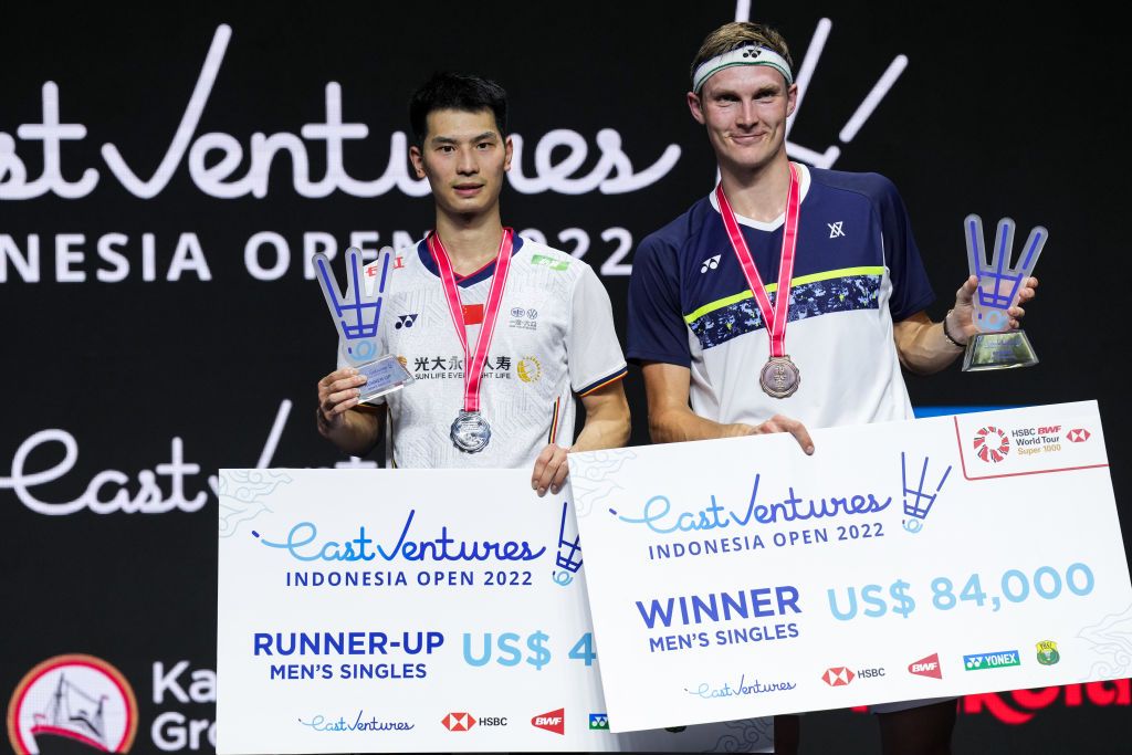 JAKARTA, INDONESIA - JUNE 19: Viktor Axelsen (R) of Denmark and Zhao Junpeng of China pose with their medals after the Men's Single Final match on day six of the Indonesia Open at Istora Senayan on June 19, 2022 in Jakarta, Indonesia. (Photo by Shi Tang/Getty Images)