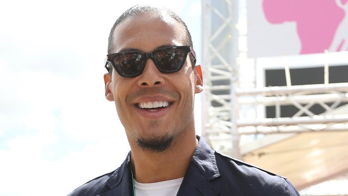 NORTHAMPTON, ENGLAND - JULY 03: Virgil van Dijk walks in the Paddock prior to the F1 Grand Prix of Great Britain at Silverstone on July 03, 2022 in Northampton, England. (Photo by Bryn Lennon - Formula 1/Formula 1 via Getty Images)