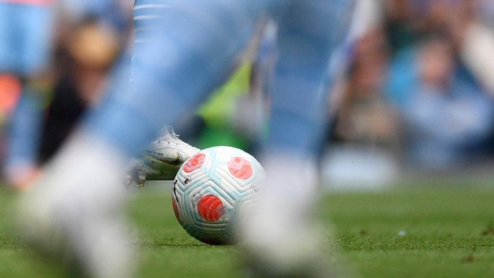 Manchester Citys Portuguese defender Joao Cancelo (rear C) controls the ball during the English Premier League football match between Manchester City and Aston Villa at the Etihad Stadium in Manchester, north west England, on May 22, 2022. - RESTRICTED TO EDITORIAL USE. No use with unauthorized audio, video, data, fixture lists, club/league logos or live services. Online in-match use limited to 120 images. An additional 40 images may be used in extra time. No video emulation. Social media in-match use limited to 120 images. An additional 40 images may be used in extra time. No use in betting publications, games or single club/league/player publications. (Photo by Oli SCARFF / AFP) / RESTRICTED TO EDITORIAL USE. No use with unauthorized audio, video, data, fixture lists, club/league logos or live services. Online in-match use limited to 120 images. An additional 40 images may be used in extra time. No video emulation. Social media in-match use limited to 120 images. An additional 40 images may be used in extra time. No use in betting publications, games or single club/league/player publications. / RESTRICTED TO EDITORIAL USE. No use with unauthorized audio, video, data, fixture lists, club/league logos or live services. Online in-match use limited to 120 images. An additional 40 images may be used in extra time. No video emulation. Social media in-match use limited to 120 images. An additional 40 images may be used in extra time. No use in betting publications, games or single club/league/player publications. (Photo by OLI SCARFF/AFP via Getty Images)