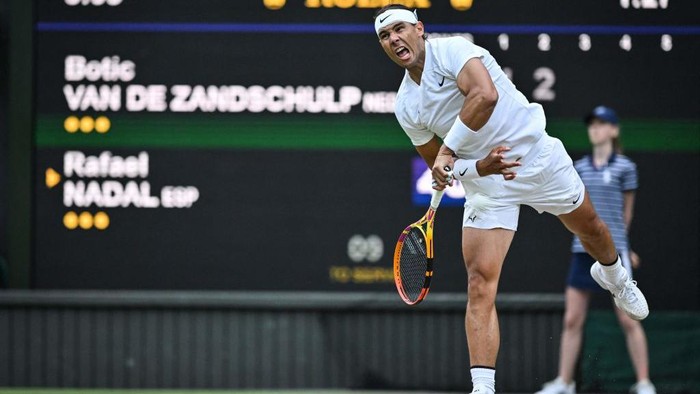 Spains Rafael Nadal serves the ball to Netherlands Botic van de Zandschulp during their round of 16 mens singles tennis match on the eighth day of the 2022 Wimbledon Championships at The All England Tennis Club in Wimbledon, southwest London, on July 4, 2022. - RESTRICTED TO EDITORIAL USE (Photo by Glyn KIRK / AFP) / RESTRICTED TO EDITORIAL USE (Photo by GLYN KIRK/AFP via Getty Images)
