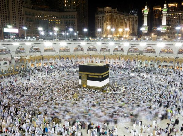 Muslim pilgrims, from all around the World, revolving around the Kaaba at night during Hajj in Saudi Arabia