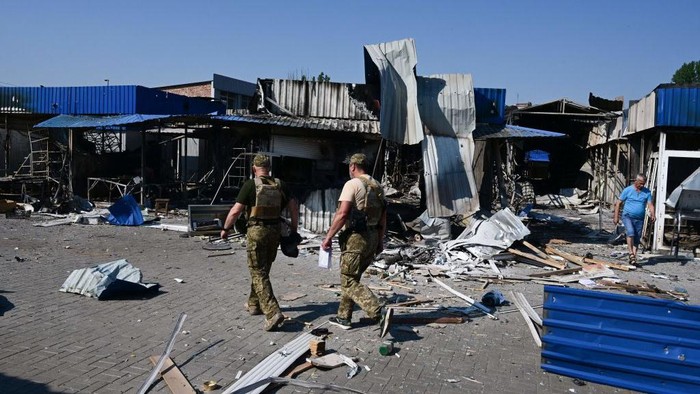 A man walks through the damage caused to the central market in Sloviansk by a suspected missile attack, on July 6, 2022, amid the Russian invasion of Ukraine. (Photo by MIGUEL MEDINA / AFP) (Photo by MIGUEL MEDINA/AFP via Getty Images)