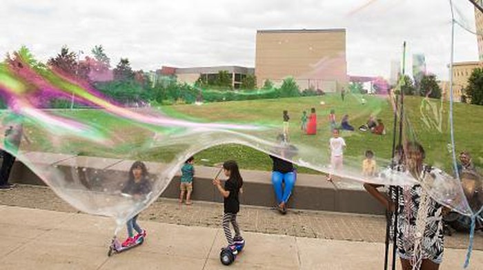 - NO PHOTO CREDIT -
- NO PHOTO CREDIT -

MISSISSAUGA, ON - JULY 6: Kids watch as a large bubble is made by Miss T, The Bubble Queen, (Tina Lemieux)  outside Mississauga Living Arts Centre. She was performing at the Centre and just passing by. CORONAPD  Toronto Star.        (Rick Madonik/Toronto Star via Getty Images)