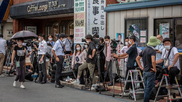 1407473529 NARA, JAPAN - JULY 09: People cycle past Nara Medical University Hospital where Japanβs former prime minister Shinzo Abe is transferred after being attacked during an election campaign on July 09, 2022 in Nara, Japan. Former Prime Minister Abe collapsed after shots were heard while he was campaigning at a rally. A suspect was apprehended and taken into custody, as Abe was rushed to a hospital via helicopter. (Photo by Yuichi Yamazaki/Getty Images)
