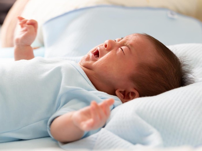 Asian baby newborn crying from diarrhea colic symptoms