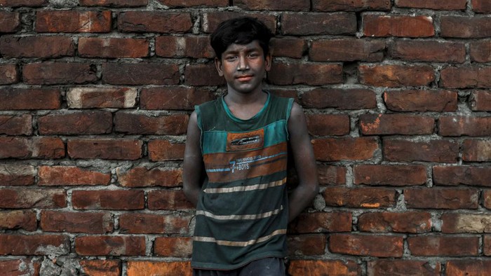 A child works inside a kitchen utensils factory at Shyampur in Dhaka, Bangladesh on July 4, 2022. (Photo by Kazi Salahuddin Razu/NurPhoto via Getty Images)