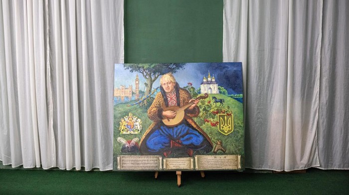 1241770987 CHERNIHIV, UKRAINE - JULY 08: (EDITORIAL USE ONLY) A painting of Boris Johnson dressed as a Ukrainian cossack by Ukrainian artists Daria Dobriakova and Yurii Kutilov assigned by Andrii Lisovyi is seen in Chernihiv Historical Museum on July 8, 2022 in Chernihiv, Ukraine. Last month, the Cossack community here named the now outgoing prime minister an honorary Cossack in relation to the United Kingdom's support for Ukraine in its fight against Russia. The painting is titled