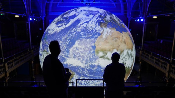 HARTLEPOOL, ENGLAND - JULY 06: Visitors come to see the Gaia artwork by UK artist Luke Jerram as it is displayed inside Hartlepool Town Hall Theatre on July 06, 2022 in Hartlepool, England. The installation is part of the launch for the Hartlepool Waterfront Festival, a two-day festival of maritime creativity that is due to take place in Hartlepool Marina this weekend. (Photo by Ian Forsyth/Getty Images)