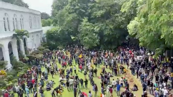 A demonstrator speaks during a protest inside the Presidents House, after President Gotabaya Rajapaksa fled, amid the countrys economic crisis, in Colombo, Sri Lanka, in this screengrab obtained from social media video on July 9, 2022. News Cutter via REUTERS ATTENTION EDITORS - THIS IMAGE HAS BEEN SUPPLIED BY A THIRD PARTY. MANDATORY CREDIT. NO RESALES. NO ARCHIVES.