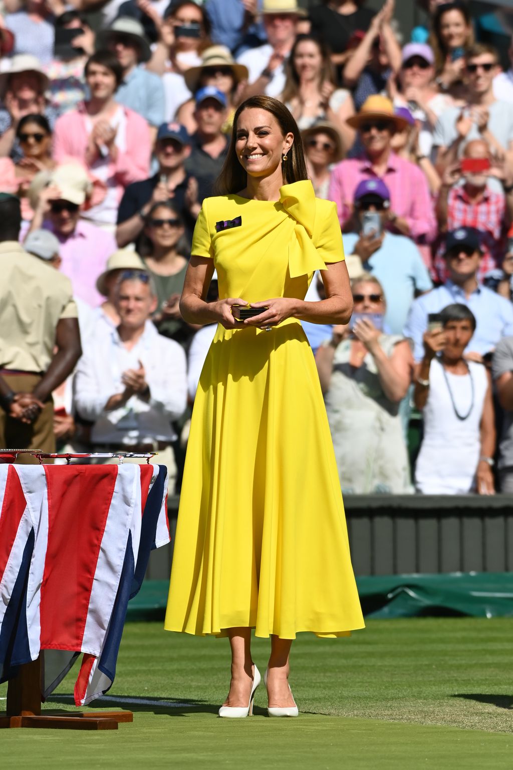 LONDON, ENGLAND - JULY 09: HRH Catherine, The Duchess of Cambridge walks out to present the trophy to Elena Rybakina of Kazakhstan after victory against Ons Jabeur of Tunisia during the Ladies' Singles Final match on day thirteen of The Championships Wimbledon 2022 at All England Lawn Tennis and Croquet Club on July 09, 2022 in London, England. (Photo by Stringer/Anadolu Agency via Getty Images)