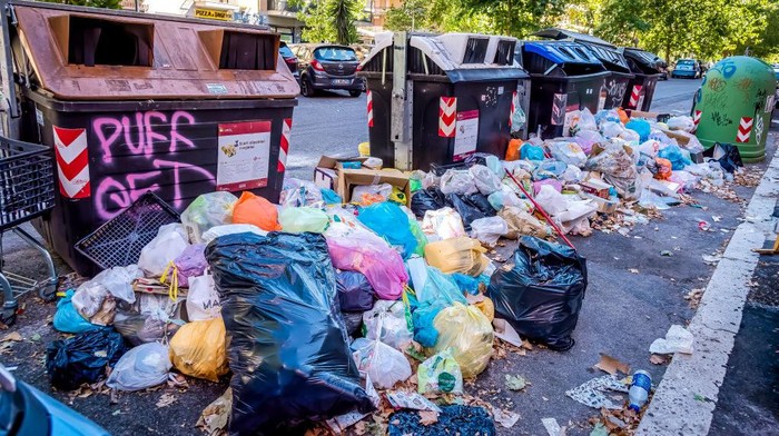 ROME, ITALY - 02 JUNE: Trash bins overflow on the street in the district of Cinecittà, as the city struggles with a garbage problem aggravated by the summer heat on 02 June 2022 in Rome, Italy.(Photo by Stefano Montesi - Corbis/Corbis via Getty Images)