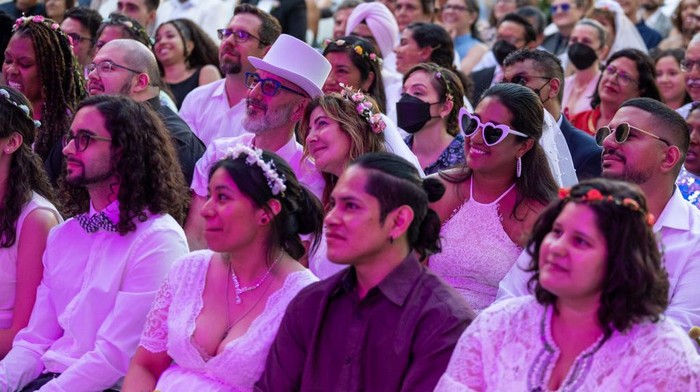 NEW YORK, NEW YORK - JULY 10: Couples participate at the (Re)Wedding at Lincoln Center on July 10, 2022 in New York City. Lincoln Center’s Summer for the City Celebrate Love: A (Re)Wedding invited a total of 500 newlyweds, people whose wedding’s were canceled or diminished due to the COVID-19 pandemic, and people who want to recommit their love to one another. (Photo by Alexi Rosenfeld/Getty Images)