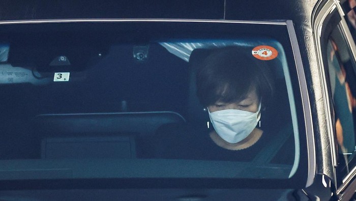 Akie Abe, wife of late former Japanese Prime Minister Shinzo Abe, who was shot while campaigning for a parliamentary election, sits in a vehicle carrying Abe's body to a night vigil at a temple, in Tokyo, Japan July 11, 2022. REUTERS/Kim Kyung-Hoon
