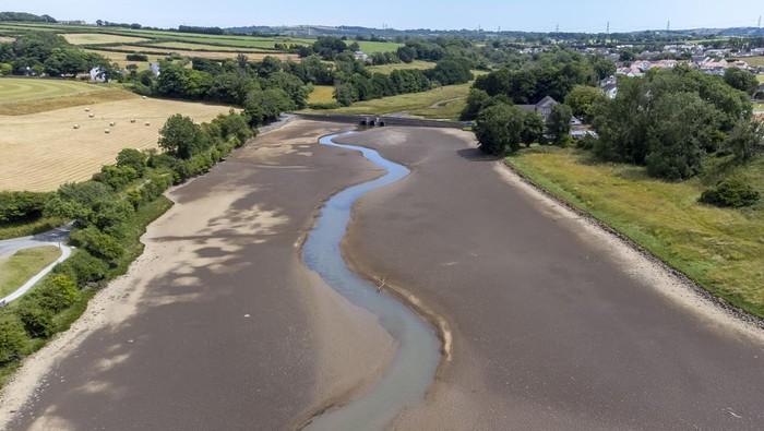 PEMBROKESHIRE, WALES - JULY 12: An aerial view during low tide in the Carew River which runs alongside Carew Castle on July 11, 2022 in Pembrokeshire, Wales. Forecasters are predicting that it could be the hottest day of the year so far with highs of 30°C. The Met Office have issued an amber weather warning for heat on July 17. (Photo by Matthew Horwood/Getty Images)