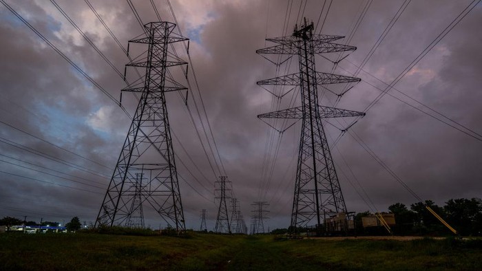 1408059450 HOUSTON, TEXAS - JULY 11: Transmission towers are seen near the CenterPoint Energy power plant on July 11, 2022 in Houston, Texas. ERCOT (Electric Reliability Council of Texas) is urging Texans to voluntarily conserve power today, due to extreme heat potentially causing rolling blackouts. ERCOT has also projected there to be no blackouts this week. (Photo by Brandon Bell/Getty Images)