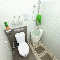 Sentuhan alam hadir di kamar mandi. Lantainya menggunakan keramik berwarna alam dipadu dengan bebatuan. (Foto: Instagram/@febyoan)