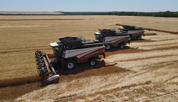 Combines harvest wheat in a field in the Rostov Region, Russia July 7, 2022. REUTERS/Sergey Pivovarov