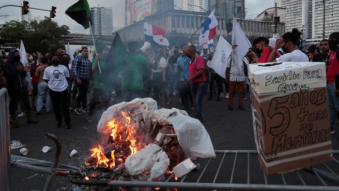 A demonstrator holds a broom during a protest to demand the government steps in to curb inflation, lower fuel and food prices, in Panama City, Panama July 12, 2022. REUTERS/Erick Marciscano