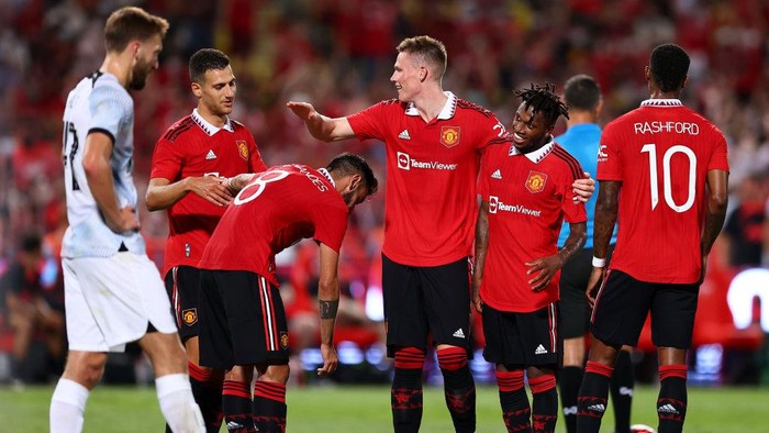 BANGKOK, THAILAND - JULY 12: Fred #17 (2R) of Manchester United celebrates with his teammates after scoring their second goal against Liverpool during the first half of a preseason friendly match at Rajamangala National Stadium on July 12, 2022 in Bangkok, Thailand. (Photo by Pakawich Damrongkiattisak/Getty Images)