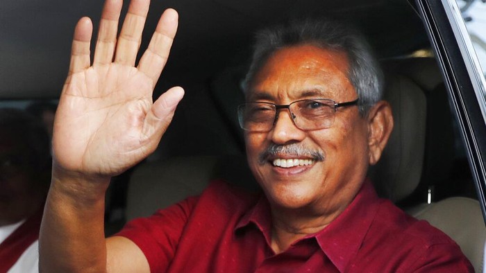 FILE - In this Sunday, Nov. 17, 2019, file photo, Sri Lankan President-elect Gotabaya Rajapaksa waves to supporters as he leaves the election commission after the announcement of his victory in Colombo, Sri Lanka. Sri Lanka’s government in early September has proposed changes to the constitution to aggrandize powers of the president, that will allow him hold key ministries and appoint officials to key positions, powers that were taken away by  a reformist government elected in 2015. The draft of the 20th Amendment to the  constitution will allow Rajapaksa to appoint top  judges, police chief, members of the public service, elections, bribery and  human rights commissions at his discretion. (AP Photo/Eranga Jayawardena, File)