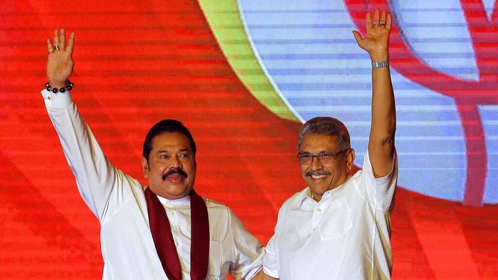 FILE - Mahinda Rajapaksa, left, and his brother Gotabaya Rajapaksa wave to supporters during a party convention held to announce Gotabaya's presidential candidacy in Colombo, Sri Lanka, Aug. 11, 2019. In Sri Lanka, the Rajapaksa family has monopolized politics in the island nation for decades. Even now, President Gotabaya Rajapaksa is still clinging to power, although the family dynasty around him has crumbled amid protests since April, 2022. (AP Photo/Eranga Jayawardena, File)