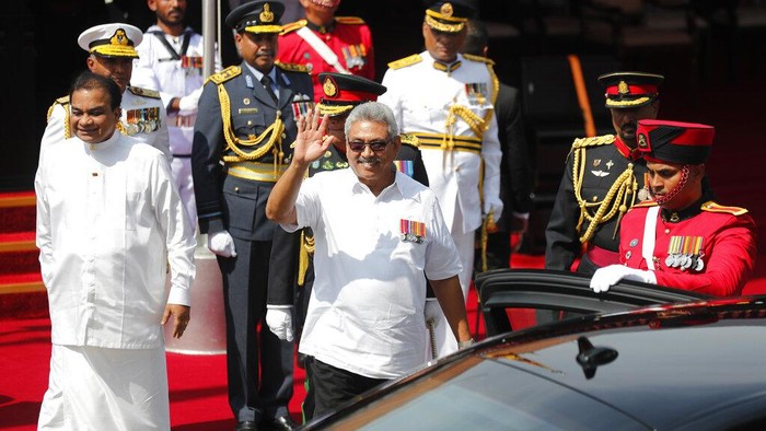 Sri Lankan President Gotabaya Rajapaksa, center, waves to public as he leaves after attending a parade to mark the anniversary of countrys independence from British colonial rule in Colombo, Sri Lanka, Tuesday, Feb. 4, 2020. (AP Photo/Eranga Jayawardena)