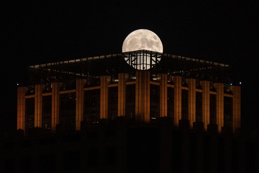 TIANJIN, CHINA - JULY 13: Super moon, also called the Buck Moon, reportedly the biggest Supermoon of this year, rises over Tianjin on July 13, 2022, in Tianjin, China. (Photo by Stringer/Anadolu Agency via Getty Images)