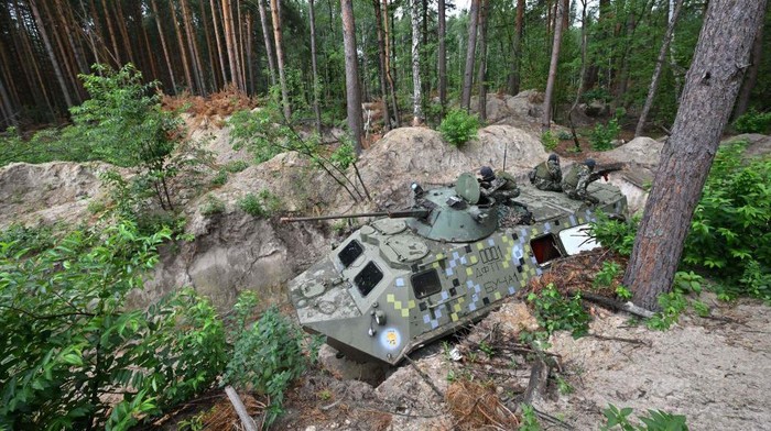 Fighters of the territorial defence unit, a support force to the regular Ukrainian army, take part in an exercise as part of the regular combat tactics classes, not far from the Ukrainian town of Bucha, Kyiv region on July 13, 2022 amid the Russian invasion of the country. (Photo by Sergei SUPINSKY / AFP) (Photo by SERGEI SUPINSKY/AFP via Getty Images)