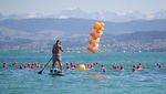 Ratusan Perenang Nyebur Massal Sebrangi Sungai Zurich di Swiss