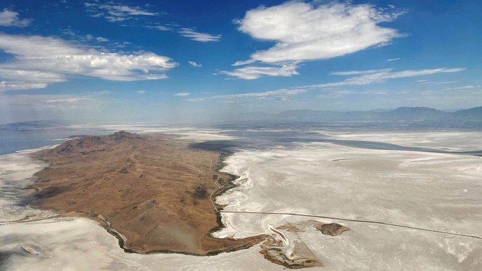 Dry land surrounds Antelope Island where there used to be water in the Great Salt Lake, in Salt Lake City, Utah, U.S., July 13, 2022. REUTERS/Brian Snyder