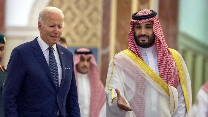In this photo released by the Saudi Royal Palace, Saudi Crown Prince Mohammed bin Salman, right, welcomes President Joe Biden upon his arrival at Al-Salam palace in Jeddah, Saudi Arabia, Friday, July 15, 2022. (Bandar Aljaloud/Saudi Royal Palace via AP)
