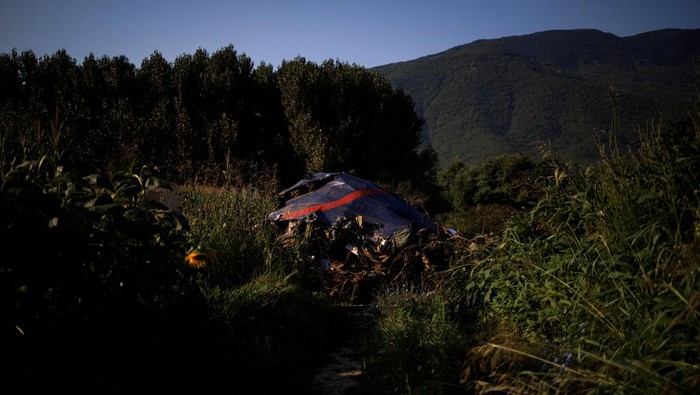 Debris is seen at the crash site of an Antonov An-12 cargo plane owned by a Ukrainian company, near Kavala, Greece, July 17, 2022. REUTERS/Alkis Konstantinidis