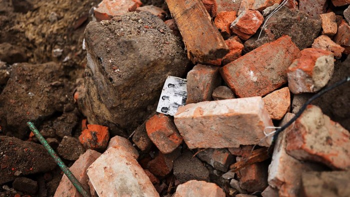 A family's picture is seen amidst debris at the site of a military strike in Chuhuiv, about 6 km from the frontline, amid Russia's invasion of Ukraine, in Kharkiv region, Ukraine July 16, 2022. REUTERS/Nacho Doce