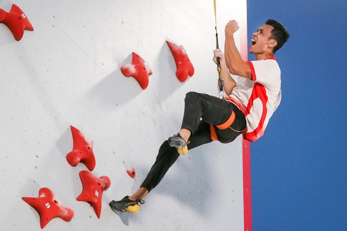 SALT LAKE CITY, UTAH - MAY 28: Veddriq Leonardo of Indonesia celebrates his first place win and breaking the speed world record during the speed climbing finals of the IFSC Climbing World Cup at Industry SLC on May 28, 2021 in Salt Lake City, Utah. (Photo by Andy Bao/Getty Images)