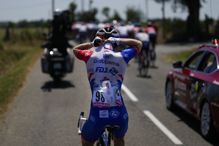 France Cycling Tour de France Australia's Michael Storer, a domestique, a rider who works for the benefit of the team, collects water bottles at the team car during the fifteenth stage of the Tour de France cycling race over 202.5 kilometers (125.5 miles) with start in Rodez and finish in Carcassonne, France, Sunday, July 17, 2022. (AP Photo/Thibault Camus)