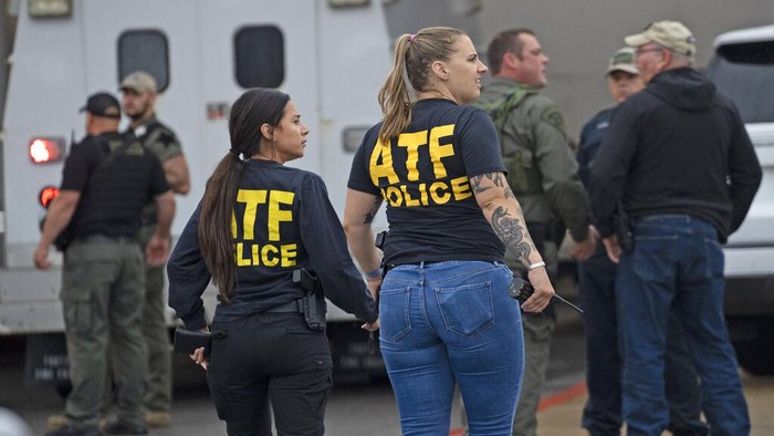 Emergency personnel gather after a deadly shooting Sunday, July 17, 2022, at the Greenwood Park Mall, in Greenwood, Ind. (Kelly Wilkinson/The Indianapolis Star via AP)