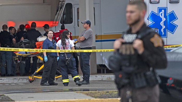 Emergency personnel gather after a deadly shooting Sunday, July 17, 2022, at the Greenwood Park Mall, in Greenwood, Ind. (Kelly Wilkinson/The Indianapolis Star via AP)