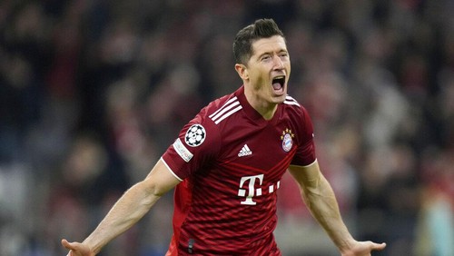 FILE - Bayerns Robert Lewandowski celebrates after scoring his sides opening goal during the Champions League, second leg, quarterfinal soccer match between Bayern Munich and Villareal at the Allianz Arena, in Munich, Germany, Tuesday, April 12, 2022. Barcelona is set to sign Poland striker Robert Lewandowski from Bayern Munich after the clubs reached an agreement in principle for his transfer, a person with knowledge of the negotiations tells The Associated Press. (AP Photo/Matthias Schrader, File)