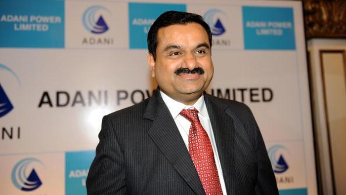 Adani Group Chairman, Gautam Adani smiles after addressing the media in Ahmedabad on July 21, 2009. Adani spoke about 
