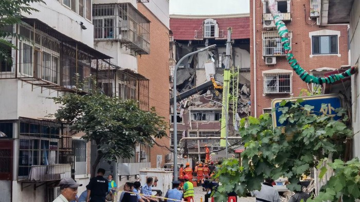 TIANJIN, CHINA - JULY 19: Fire trucks arrive at a gas explosion site on July 19, 2022 in Tianjin, China. The gas explosion occurred in a residential building in Tianjin at around 7:15 a.m. on Tuesday. (Photo by VCG/VCG via Getty Images)