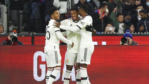 Manchester Uniteds Anthony Martial, centre, is congratulated by teammates Marcus Rashford, right, and Jadon Sancho, left, after scoring his teams first goal during a pre-season game between Manchester United and Crystal Palace at the Melbourne Cricket Ground in Melbourne, Australia, Tuesday, July 19, 2022. (AP Photo/Asanka Brendon Ratnayake)