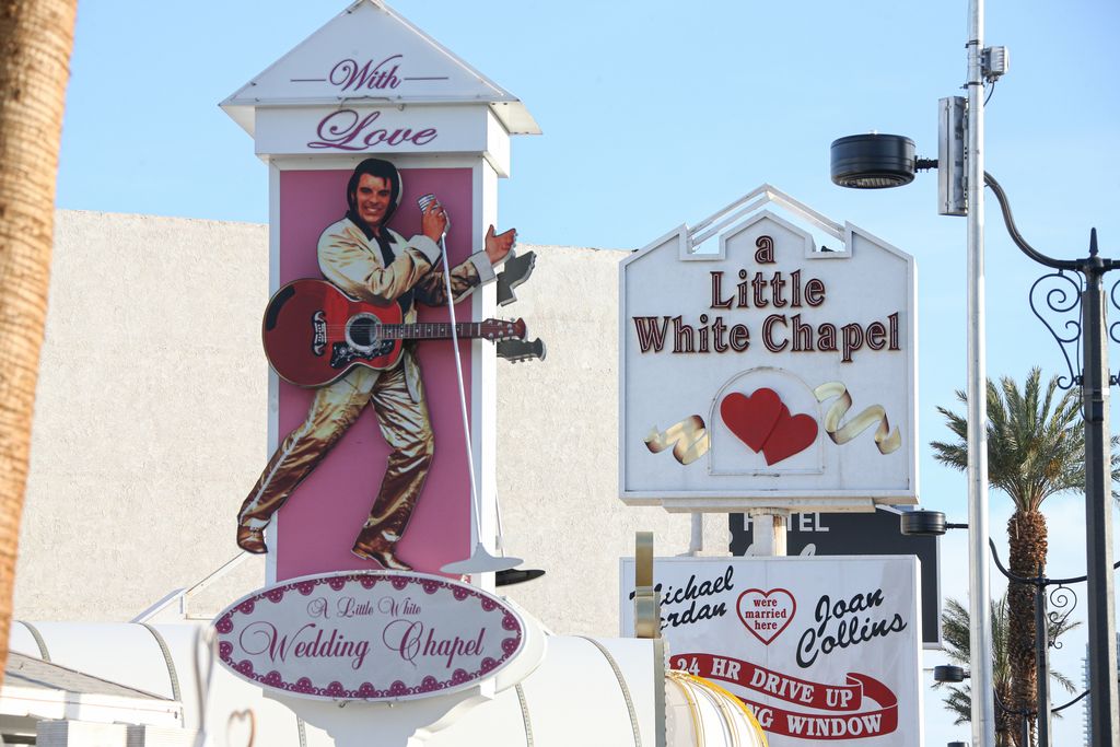 LAS VEGAS, NEVADA, UNITED STATES - 2022/06/03: A replica of Elvis Presley is displayed on a sign in front of the Little White Chapel. Authentic Brands Group, which owns Elvis Presley's intellectual property rights, has sent several Las Vegas wedding chapels cease-and-desist letters requesting them to stop using Elvis Presley's image and likeness in their operations. (Photo by Gabe Ginsberg/SOPA Images/LightRocket via Getty Images)