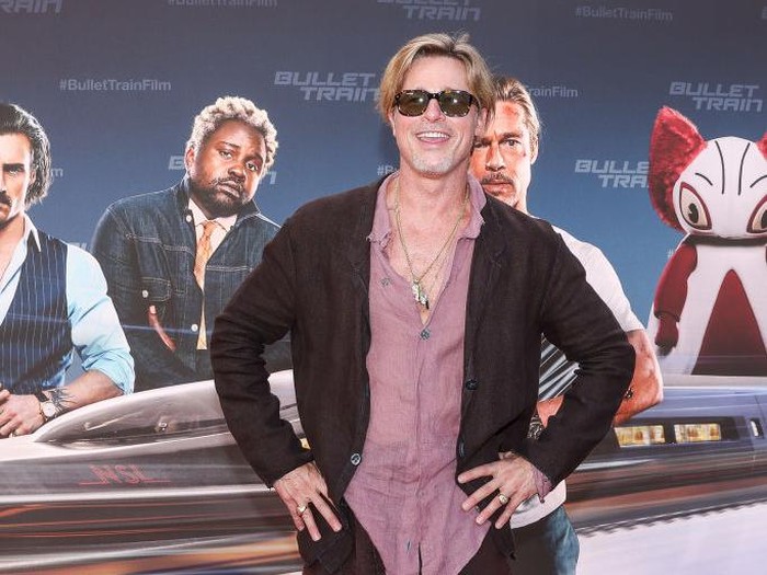 19 July 2022, Berlin: Brad Pitt, actor, wears a skirt as he arrives at the German premiere of the motion picture 