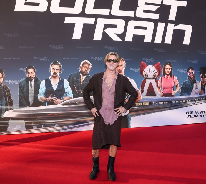 19 July 2022, Berlin: Brad Pitt, actor, wears a skirt as he arrives at the German premiere of the motion picture 