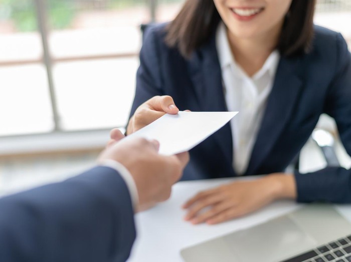 Ilustrasi Gaji Tertinggi di Indonesia Young Asian business woman receiving salary or bonus money from boss or manager at office happily.