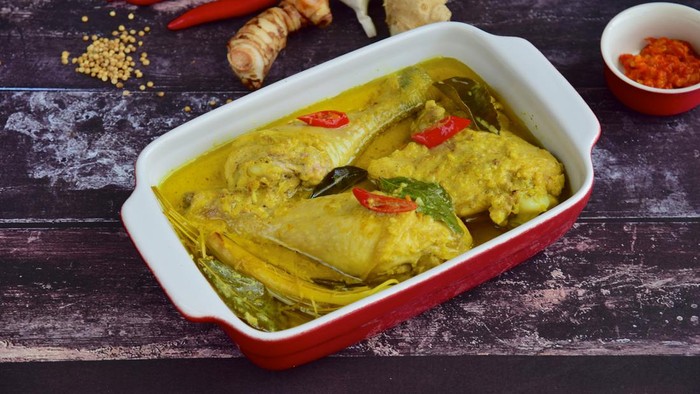Opor ayam, chicken cooked in coconut milk. Originated from Central Java, Indonesia, served with sambal. Popular dish for lebaran or Eid al-Fitr