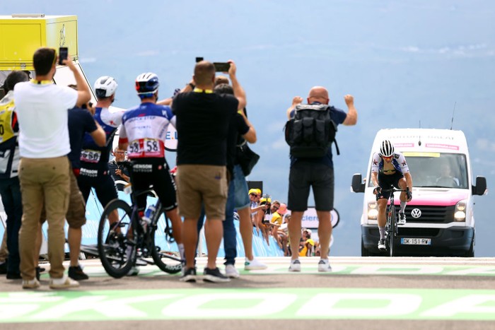 Quick-Step Alpha Vinyl Team's Dutch rider Fabio Jakobsen (C) is assisted after he collapsed while crossing the finish line seconds before the cut-off time during the 17th stage of the 109th edition of the Tour de France cycling race, 129,7 km between Saint-Gaudens and Peyragudes, in southwestern France, on July 20, 2022. (Photo by Anne-Christine POUJOULAT / AFP) (Photo by ANNE-CHRISTINE POUJOULAT/AFP via Getty Images)