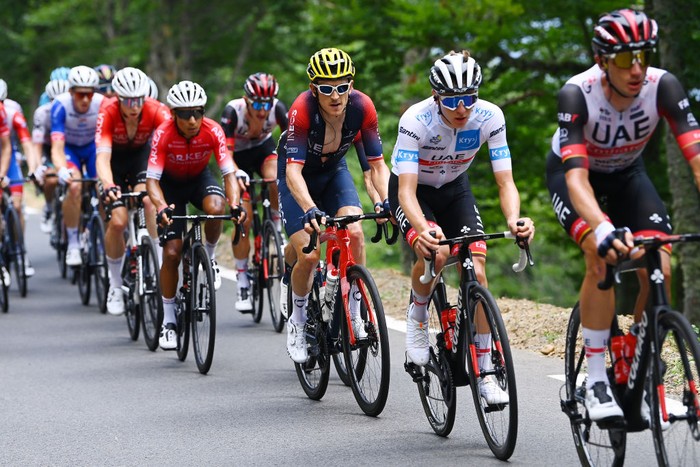 1242015020 UAE Team Emirates team's Slovenian rider Tadej Pogacar wearing the best young rider's white jersey (R) cycles ahead of Jumbo-Visma team's Danish rider Jonas Vingegaard wearing the overall leader's yellow jersey (C) during the 17th stage of the 109th edition of the Tour de France cycling race, 129,7 km between Saint-Gaudens and Peyragudes in southwestern France, on July 20, 2022. (Photo by Anne-Christine POUJOULAT / AFP) (Photo by ANNE-CHRISTINE POUJOULAT/AFP via Getty Images)