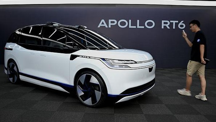 This picture taken on July 20, 2022 shows Baidu's Apollo RT6 next-generation autonomous vehicle during its unveiling in Beijing. - The Apollo RT6 is designed for fully autonomous driving with detachable steering wheel, and is set to join the Apollo Go ride-hailing service starting in 2023. (Photo by Noel Celis / AFP) (Photo by NOEL CELIS/AFP via Getty Images)
